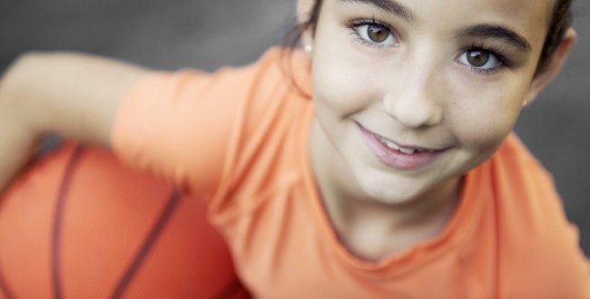 Little Girl Holding Basketball